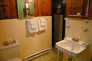 The bathroom has a full tub and shower.